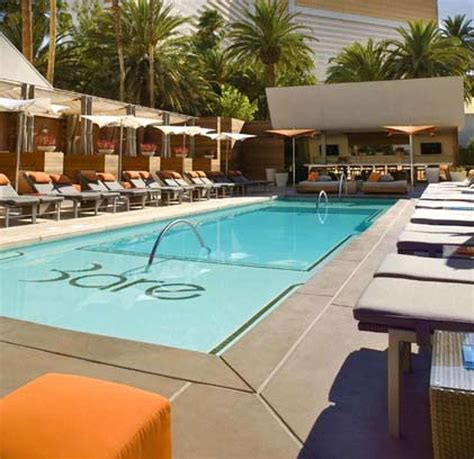 Las Vegas adult pools encourage topless sunbathing .